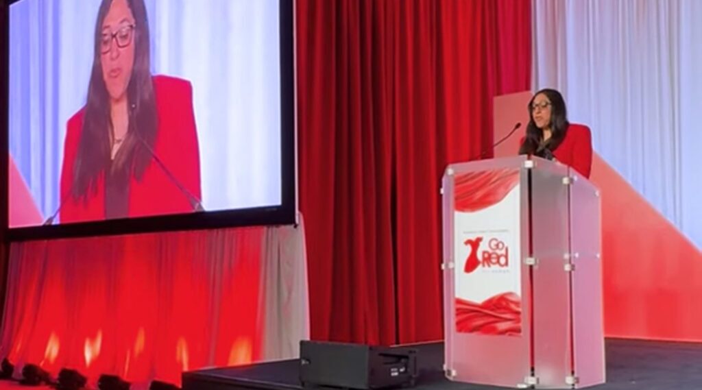 Priya Bathija Speaking on stage at the 2025 American Heart Association Go Red for Women Luncheon in Columbus, Ohio.